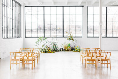 wedding ceremony flowers with chairs