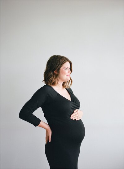 simple maternity photo black dress studio silhouette