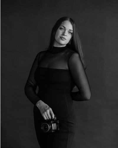 Heather Thompson, Dallas-based wedding photographer, specializing in luxury and fine art wedding photography. Captured in a classic black-and-white portrait.