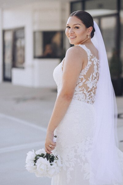 Captured just after her wedding ceremony, this image showcases a soft bridal makeup look by Book Sothana in Jacksonville, FL. The makeup emphasizes radiant skin, natural brows, and subtle lashes, allowing the bride’s authentic beauty to shine through. Book Sothana's approach to wedding makeup ensures every bride feels effortlessly beautiful while maintaining durability for a full day of photos and celebration. Specializing in natural, elegant, and long-wear bridal looks, Book Sothana brings a calming presence to the bridal suite. If you’re looking for an experienced, thoughtful bridal makeup artist in Jacksonville, FL, Book Sothana offers customized beauty services that enhance your glow on your most important day. Visit https://booksothana.com/ or call (904) 597-0867 to schedule a consultation.

