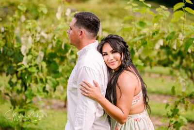 Bride and Groom pose in vineyard in Leesburg VA