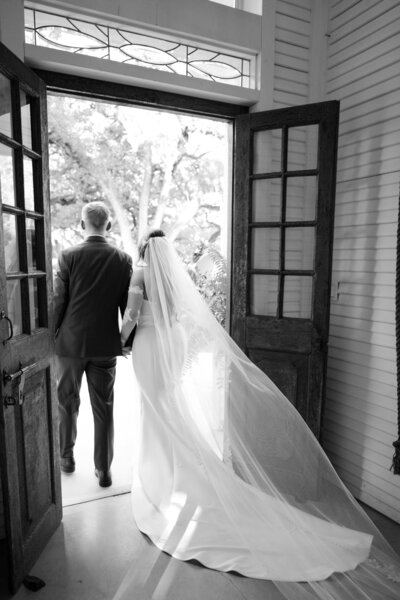 Editorial bridal portrait in ivory lace dress and white hat, captured by a luxury Austin wedding photographer for timeless wedding inspiration across Texas and beyond