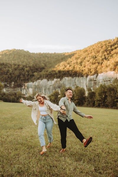 couple-lauching-and-kicking-in-field