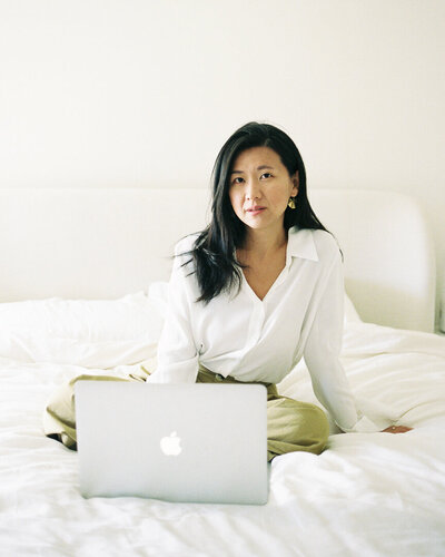 Showit web designer holding coffee mug in office