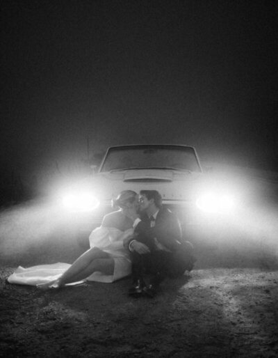 Cinematic nighttime elopement photography with vintage car headlights—example of the elopement photography packages for couples.