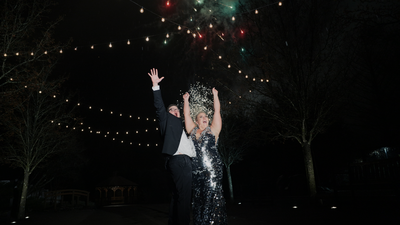 couple cheering during fireworks