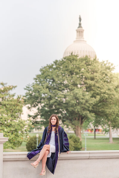 graduate with dc capitol behind her