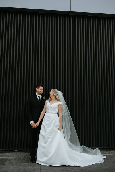 bride and groom portrait against black background taken by fargo wedding photographer kiella lawrence