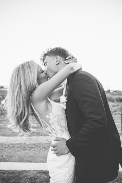 Hollywood bride spinning in dress in garden wedding