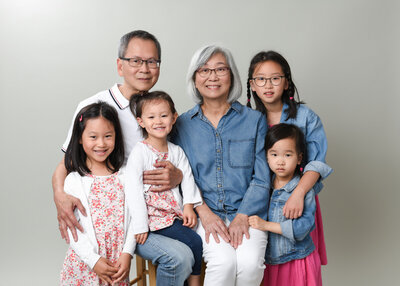 in studio photoshoot of grandparents with grandchildren