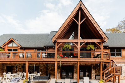 Wooden lodge with balconies and lush greenery