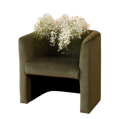 green velvet chair covered in baby's breath flowers