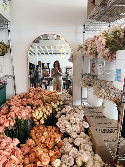 Mary Love and Mackenzie of Rosemary and Finch wedding floral designers, florists, in Nashville, TN. Specialize in large scale weddings, installation, travel weddings. Broken arch floating arch fall wedding ceremony flowers in copper, pink, burgundy, mauve, and sage.