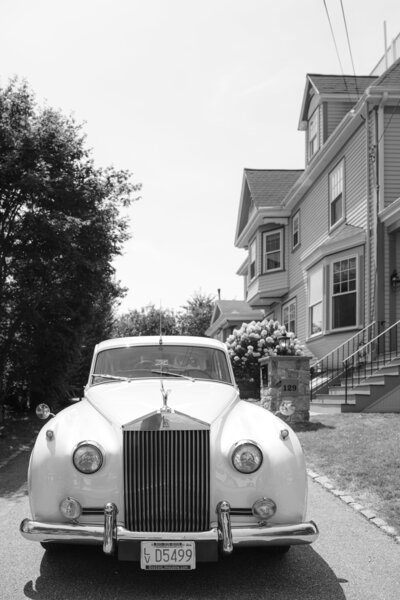 close up of wedding dress and silver bridal shoes
