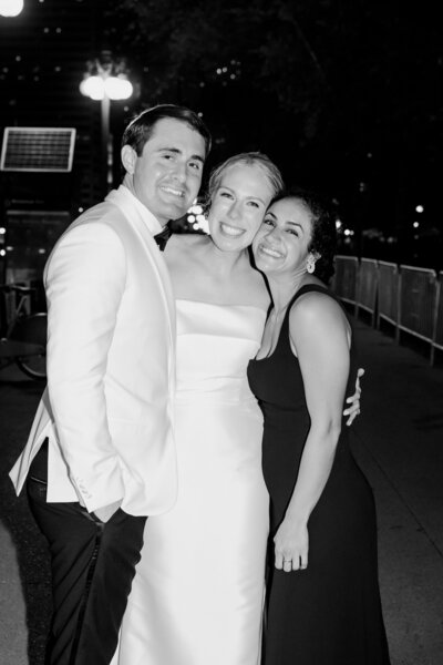 Photographer, Teresa Williams, with one of her wedding couples smiling bright during their wedding reception