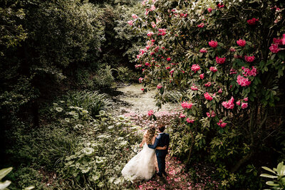 Bride and groom in serene gardens