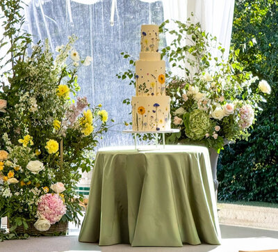 Jersey wedding cakes - dark blue  cake on a table with flowers
