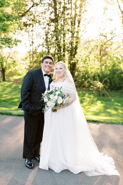 Bride and groom smiling on wedding day at Maple Grove Estate in Knoxville, Tennessee, during a spring ceremony.