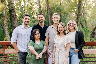 The HomeFound Real Estate Group stands outdoors and smiles at the camera. Representing Boise Experiential Therapy Collective vendor profile for the Crush Collective wedding show.