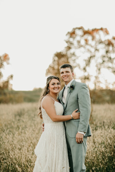 Wedding Photo of bride and groom in a field