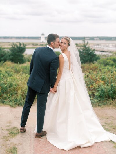Bride and groom kissing Harborview Hotel wedding