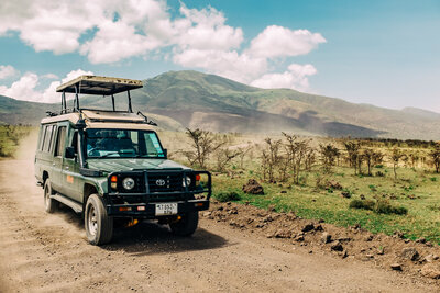 Safari truck driving along the road in the Serengeti