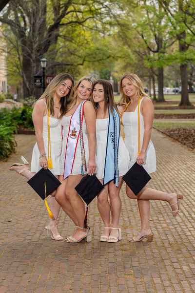 A University of South Carolina student taking his senior portraits on campus