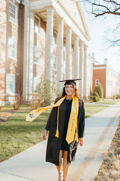 College senior poses for photos at wichita state university with ashley cole photography