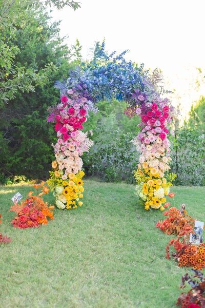 Colorful floral arch designed by social and corporate event florist Flora Fetish.