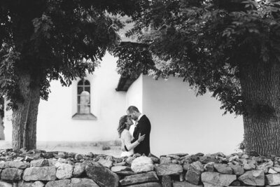 hugging & laughing wedding couple