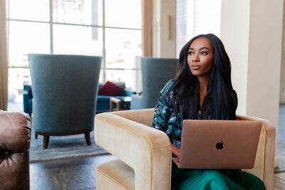 Professional women working on laptop in a coworking space