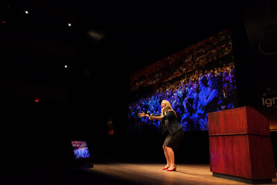 Sally Z delivering keynote on overcoming self-doubt