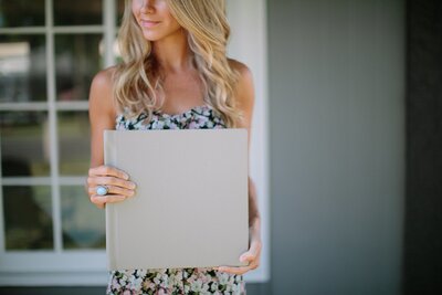 woman holding a wedding album