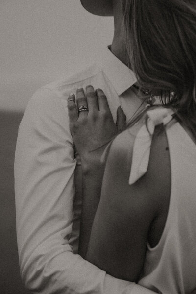 Detail shot of engagement and wedding ring of an elopement at Cape Kiwanda Beach.