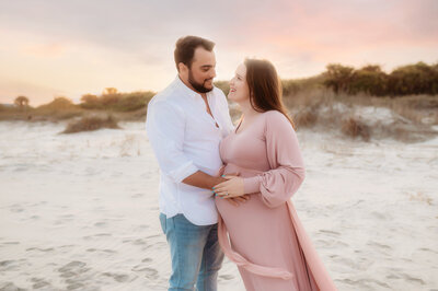 Expectant Mother poses for Maternity Portraits on the beach in Charleston, SC.