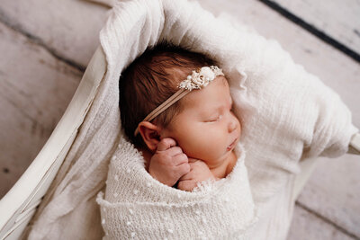 Newborn baby swaddled in studio, Wedding Photography Minneapolis. 
