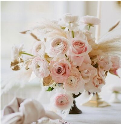 Soft pink roses and pampas grass centerpiece