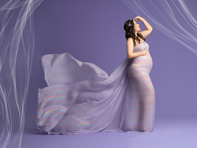 Pregnant woman in gown for maternity shoot in orlando
