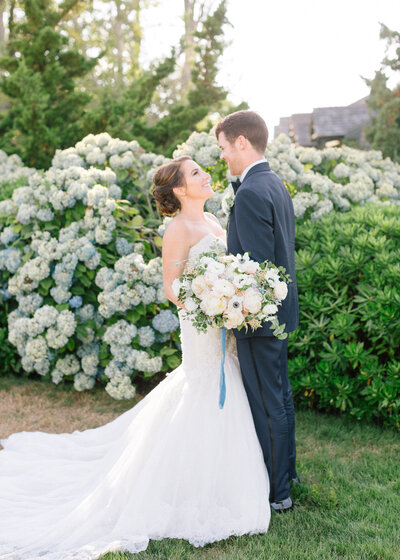 Bride and Groom with bouquet and hydrangeas