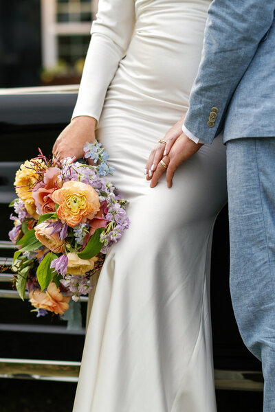 Bride holding her bouquet with her groom in Wilmington, NC
