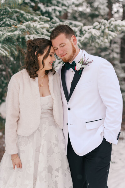 couple embraces at their wedding day at Black Diamond Lodge in Durango CO