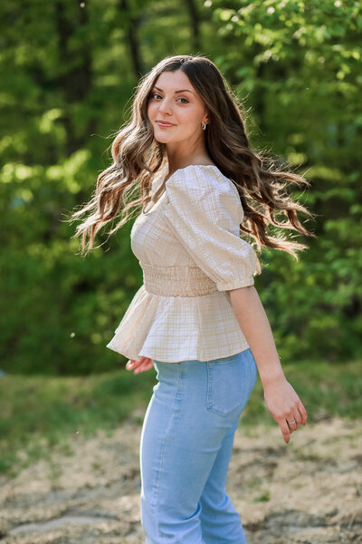 Senior with hair blowing in the breeze | Senior Photography Session