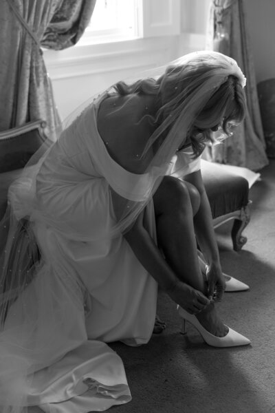 Lucy putting her shoes on