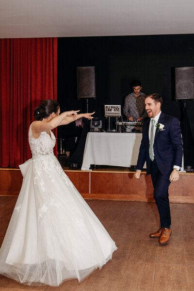 Fun moment of a couple's first dance at the wedding reception.