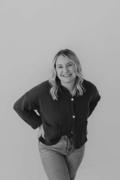 Black and white brand portrait of Michigan and Ohio photographer Emily Rowan, specializing in candid, heartfelt storytelling.
