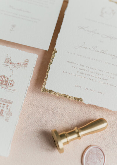 bespoke invitation suite made by kaylyn leighton. Featuring gold wax seal and hand foiled gold pages.