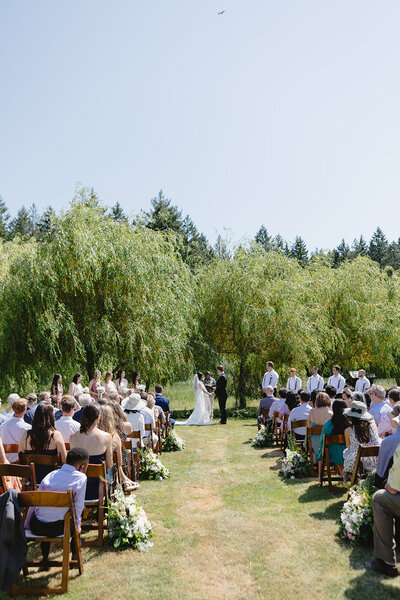 Outdoor willow lined wedding ceremony
