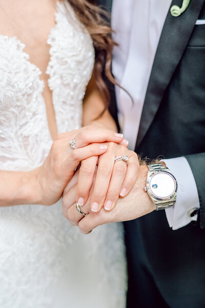 bride and groom holding hands