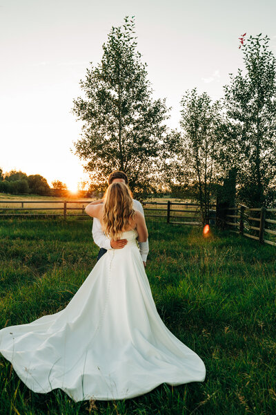 Bride and Groom at sunset taking photos in Bozeman Montnana