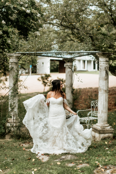 couple holding each other in the doorway of a cottage